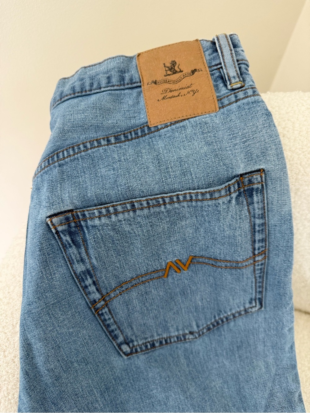 Relaxed Light Blue Women's Jeans with Subtle Orange Stitching - Denimist
